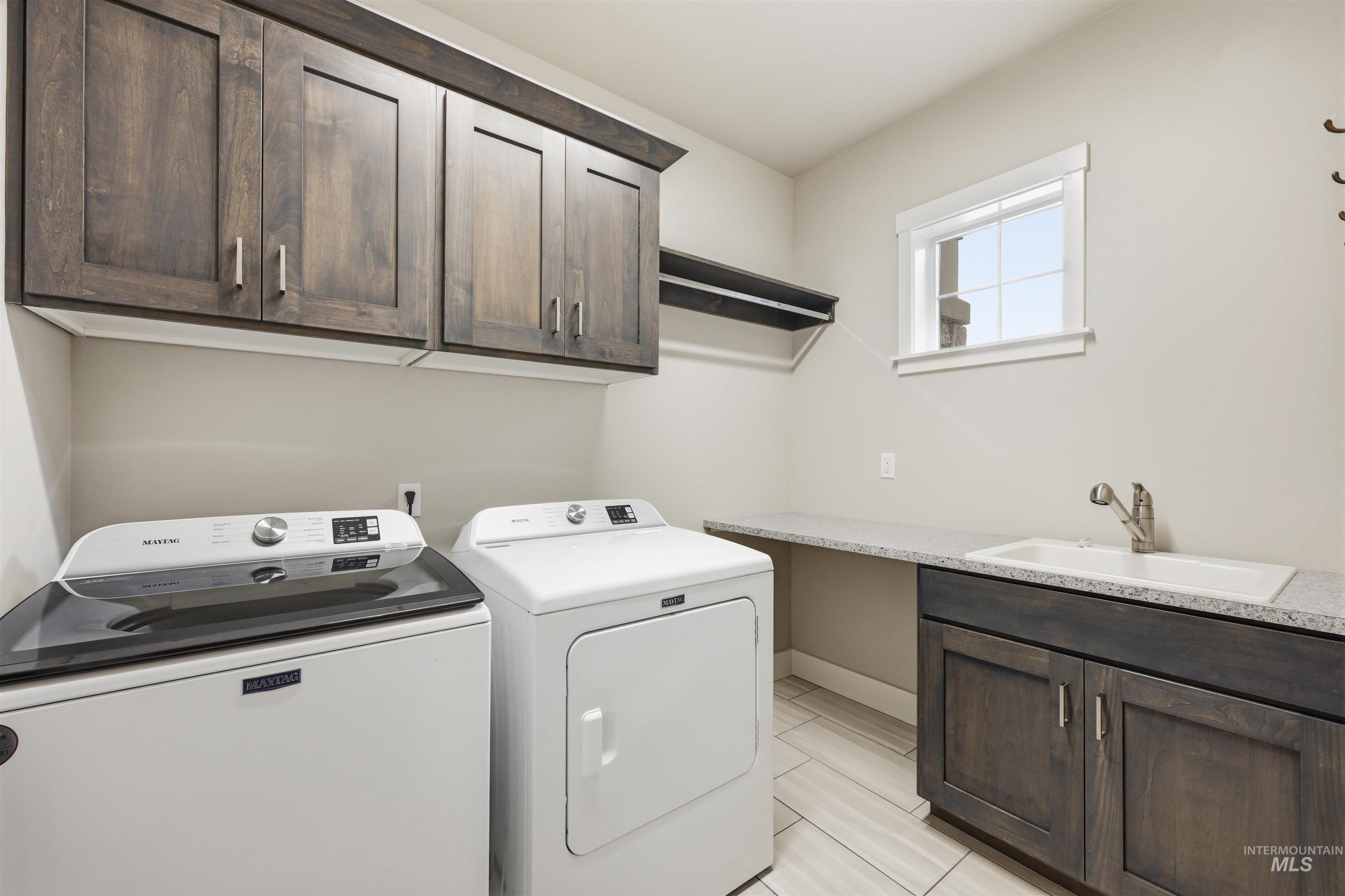 2229 East Grayson Street Meridian, ID 83642 - Photo 34 of 40 Washroom with washer and clothes dryer and cabinet space
