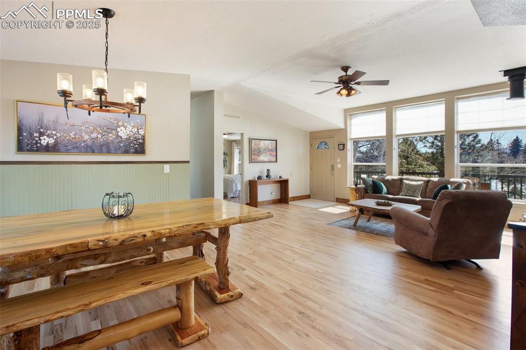 63 Bear Claw Trail Divide, CO 80814 - Photo 13 of 28 a living room with furniture and a chandelier