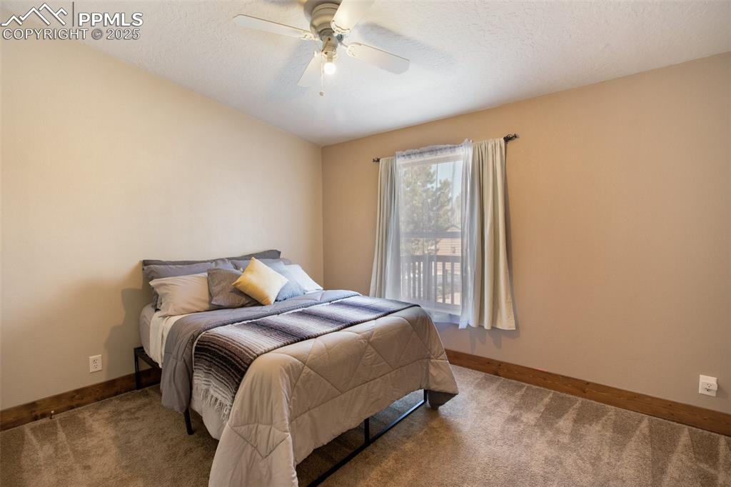 63 Bear Claw Trail Divide, CO 80814 - Photo 18 of 28 a bed sitting in a bedroom next to a window