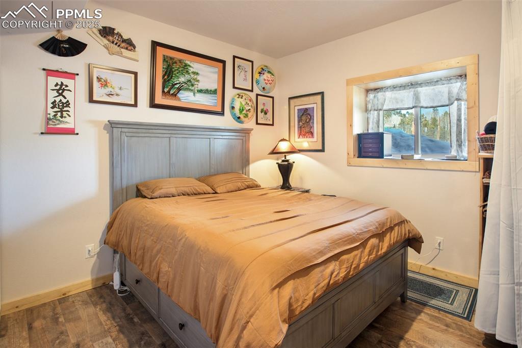 63 Bear Claw Trail Divide, CO 80814 - Photo 26 of 28 a bedroom with a bed and a window