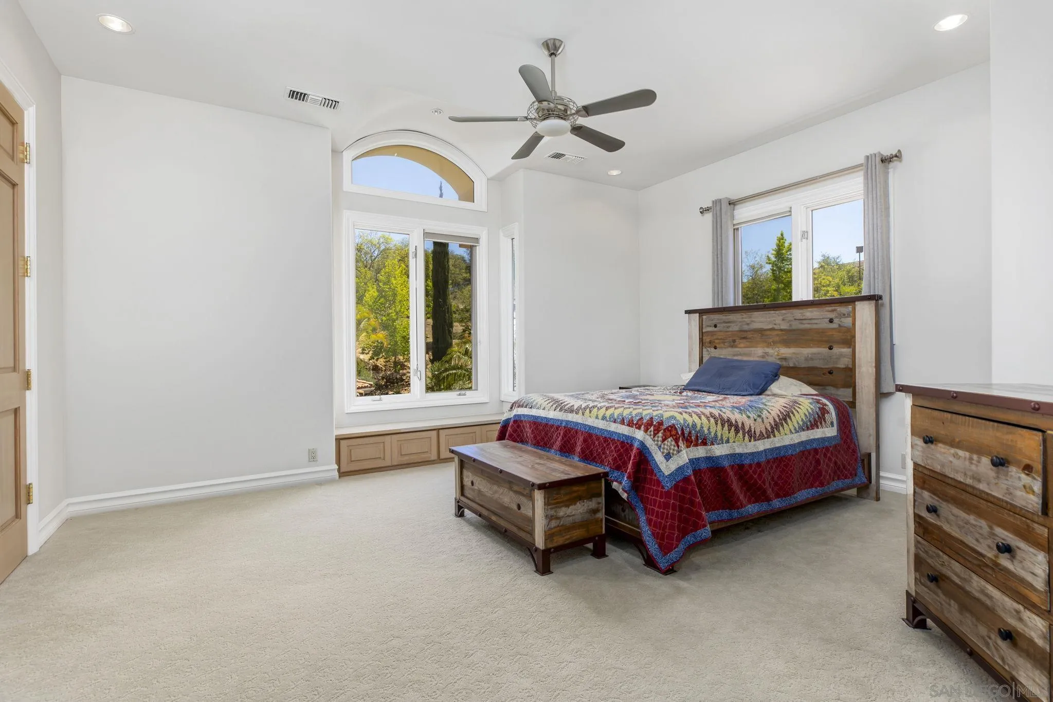 14440 Ridge Ranch Road Valley Center, CA 92082 - Photo 51 of 73 a living room with a bed furniture and a window