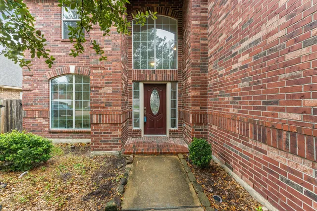 a front view of a house with large windows