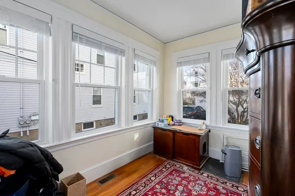 a room with furniture a rug and a window
