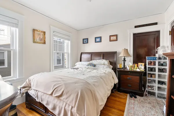 a bedroom with a bed and a dresser