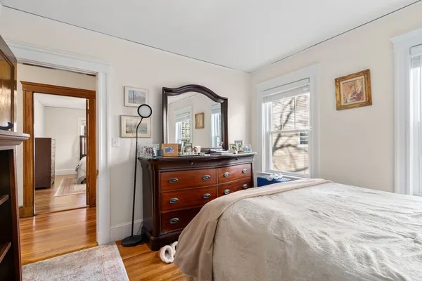 a bedroom with a bed and a dresser
