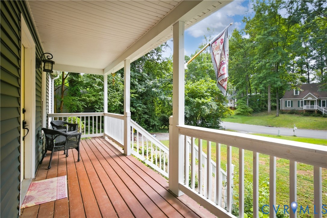7224 Full Rack Drive Midlothian, VA 23112 - Photo 3 of 36 Covered porch with wood-finish decking, white rail
