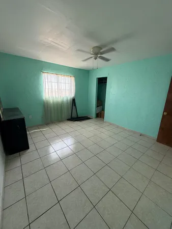 a view of empty room with windows