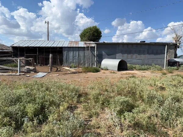 a row of car parked in front of a building