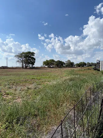 a view of a lake with a big yard