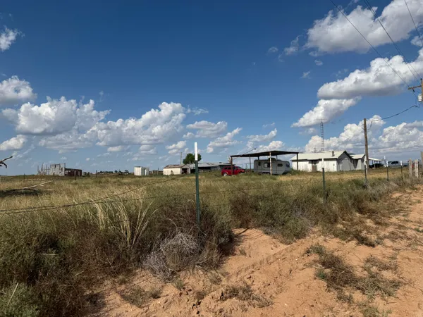 a view of a lake with houses in the back