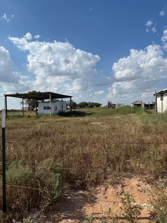 a view of a lake with houses in the back