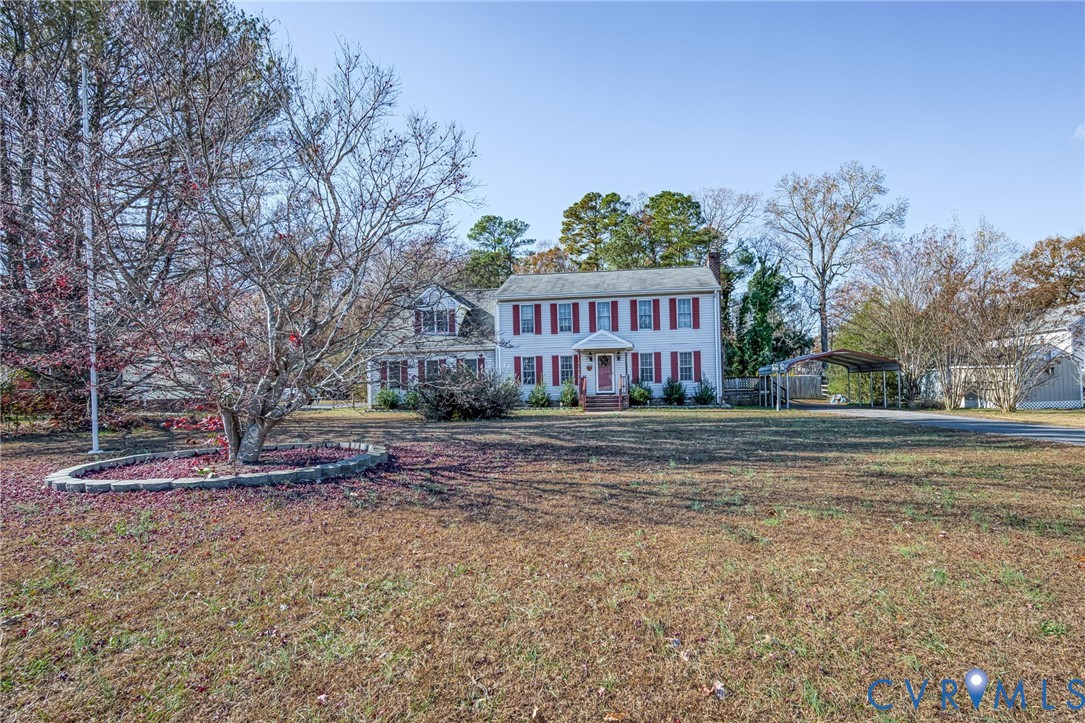 8910 Tunstall Road New Kent, VA 23124 - Photo 1 of 45 Colonial inspired home featuring a carport and a f