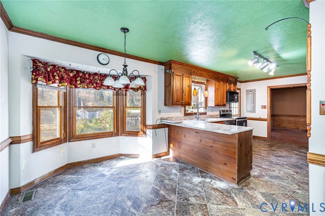 8910 Tunstall Road New Kent, VA 23124 - Photo 14 of 45 Kitchen featuring a textured ceiling, a chandelier