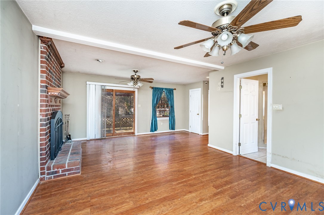8910 Tunstall Road New Kent, VA 23124 - Photo 16 of 45 Unfurnished living room featuring ceiling fan, lig