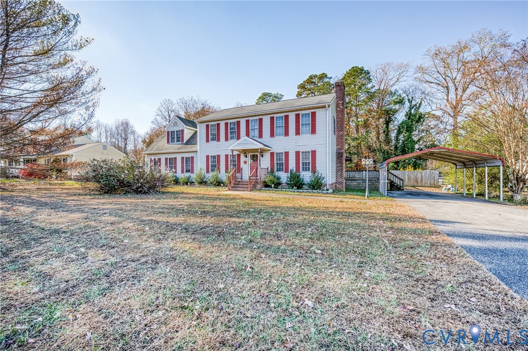 8910 Tunstall Road New Kent, VA 23124 - Photo 2 of 45 Colonial-style house with a chimney, a detached ca
