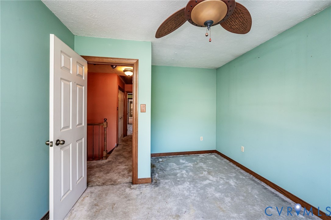 8910 Tunstall Road New Kent, VA 23124 - Photo 26 of 45 Unfurnished bedroom featuring a textured ceiling a