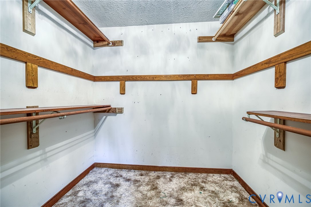 8910 Tunstall Road New Kent, VA 23124 - Photo 33 of 45 Spacious closet featuring carpet flooring
