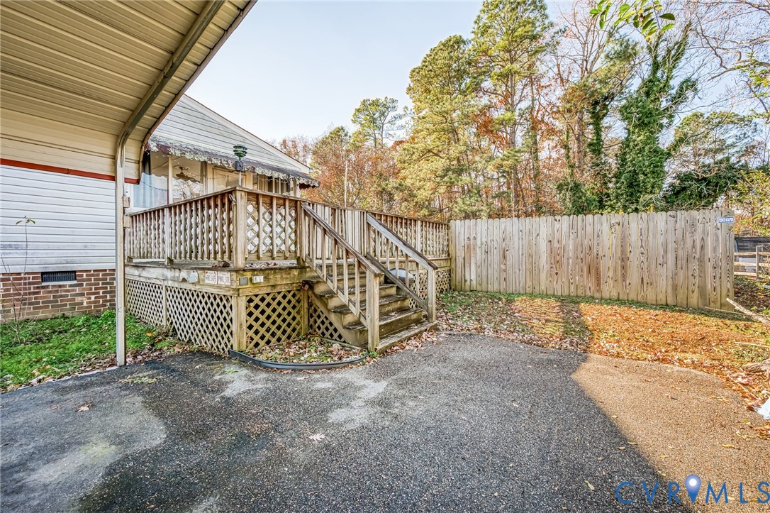 8910 Tunstall Road New Kent, VA 23124 - Photo 39 of 45 View of patio with a deck and stairway