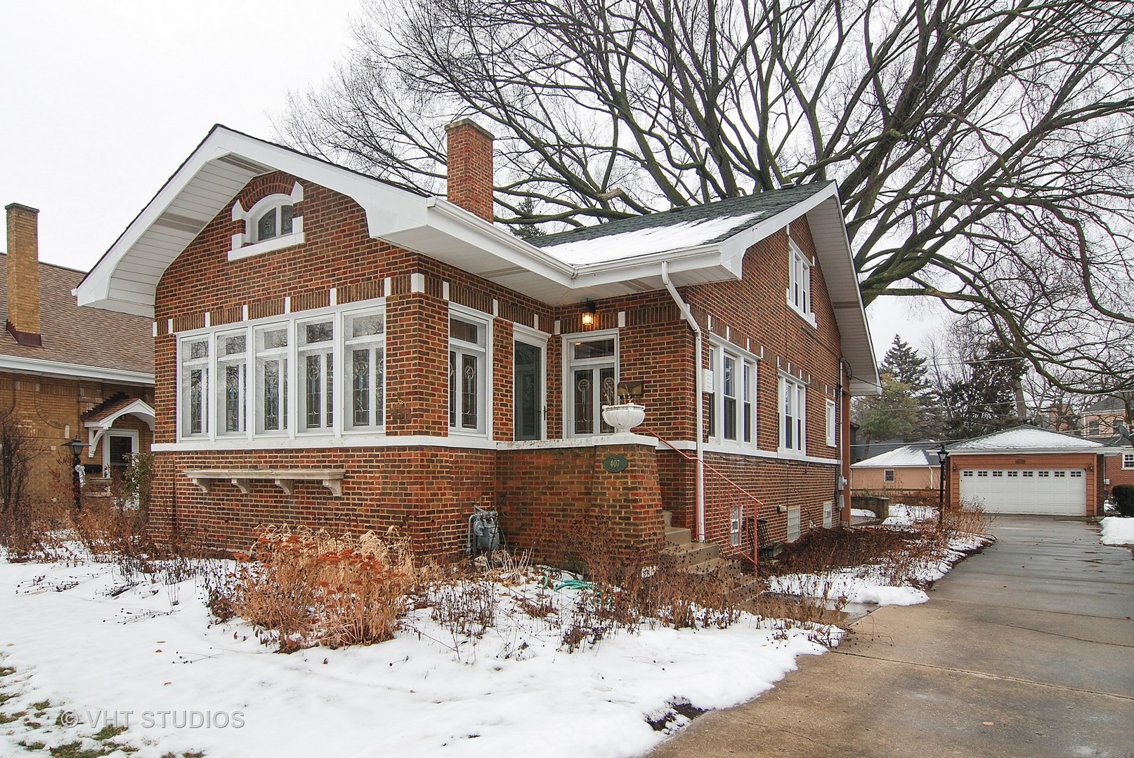 407 Longcommon Road Riverside, IL 60546 - Photo 1 of 22 a front view of a house with a yard