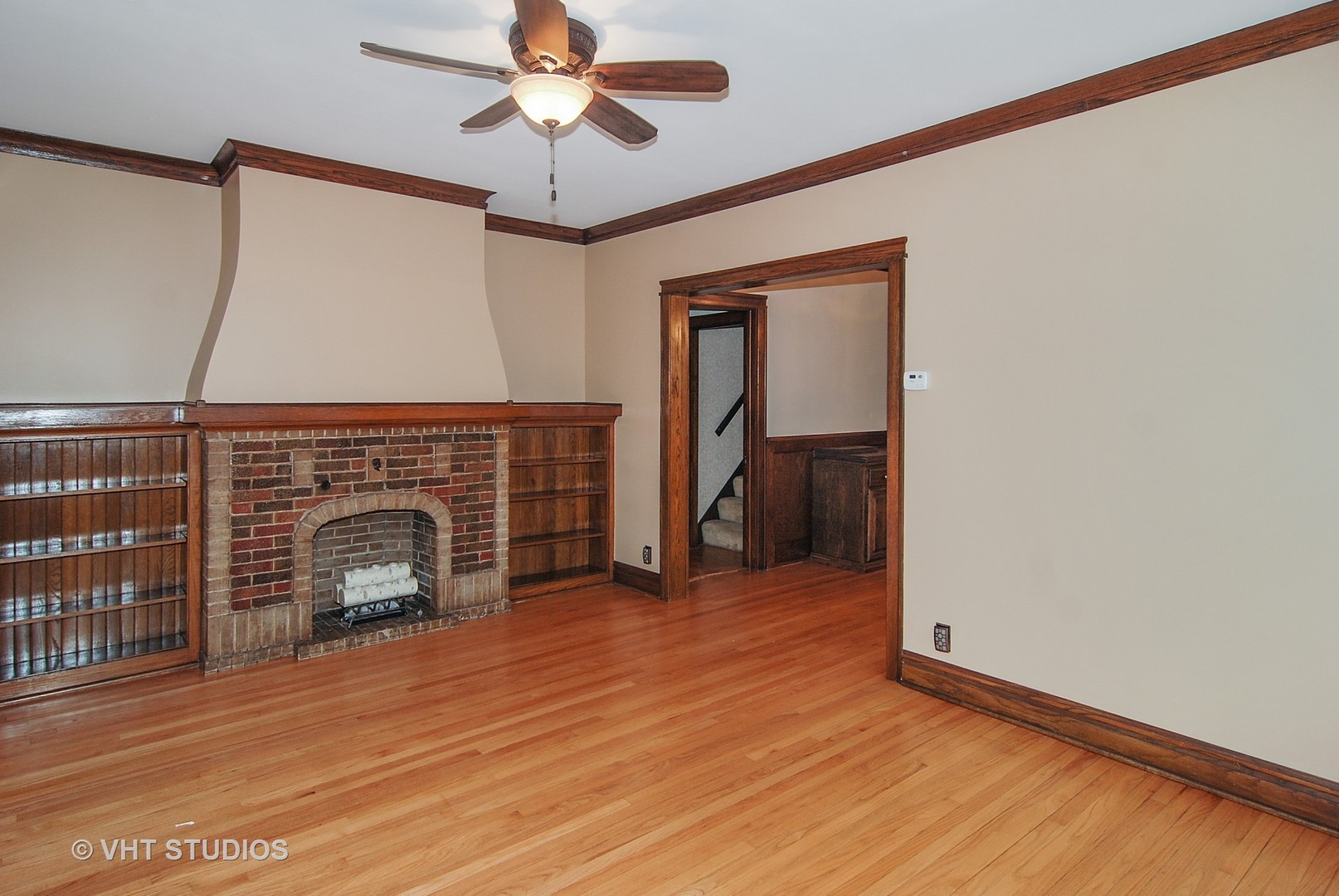407 Longcommon Road Riverside, IL 60546 - Photo 3 of 22 a view of empty room with wooden floor and fan
