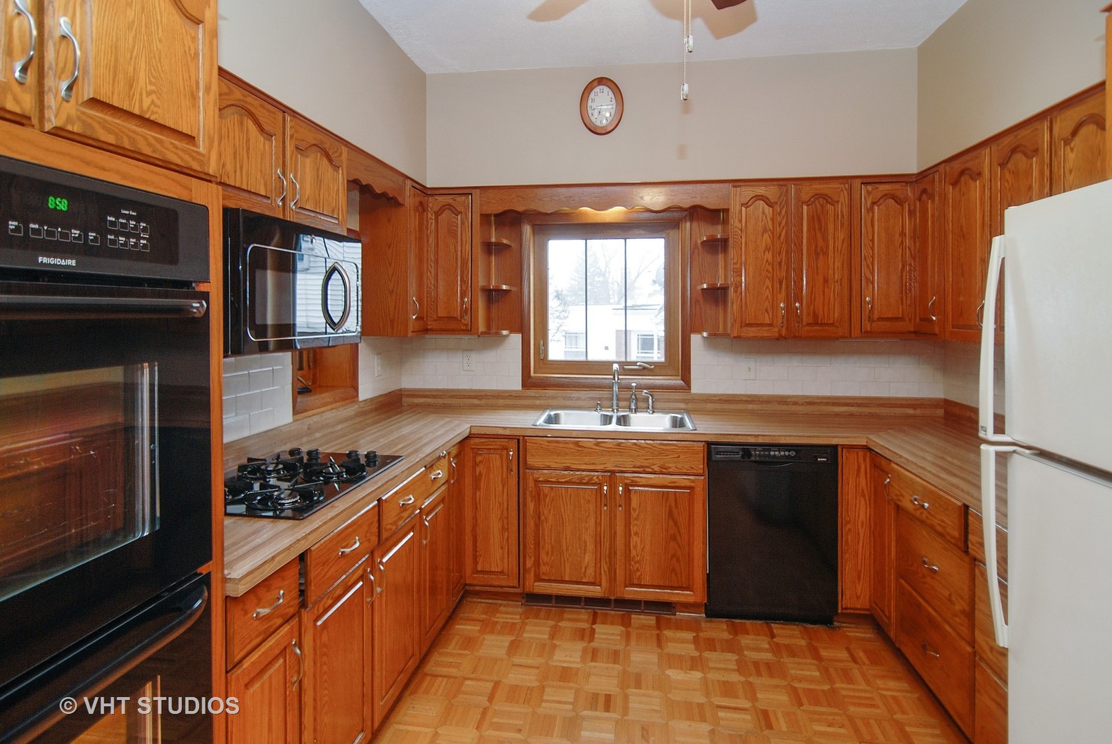 407 Longcommon Road Riverside, IL 60546 - Photo 4 of 22 a kitchen with stainless steel appliances granite countertop a stove sink and cabinets