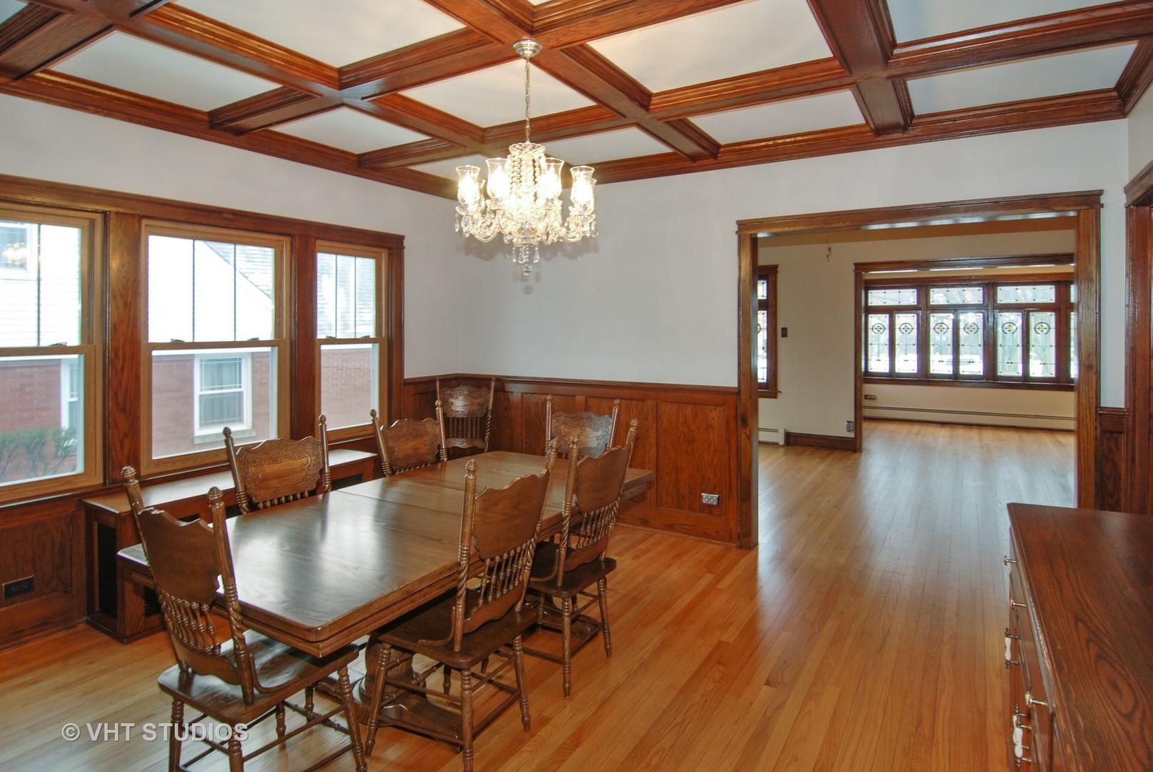 407 Longcommon Road Riverside, IL 60546 - Photo 7 of 22 a dining room with furniture a chandelier and wooden floor