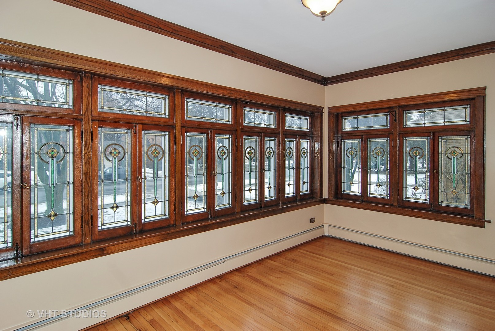 407 Longcommon Road Riverside, IL 60546 - Photo 8 of 22 a view of an empty room with wooden floor and a window