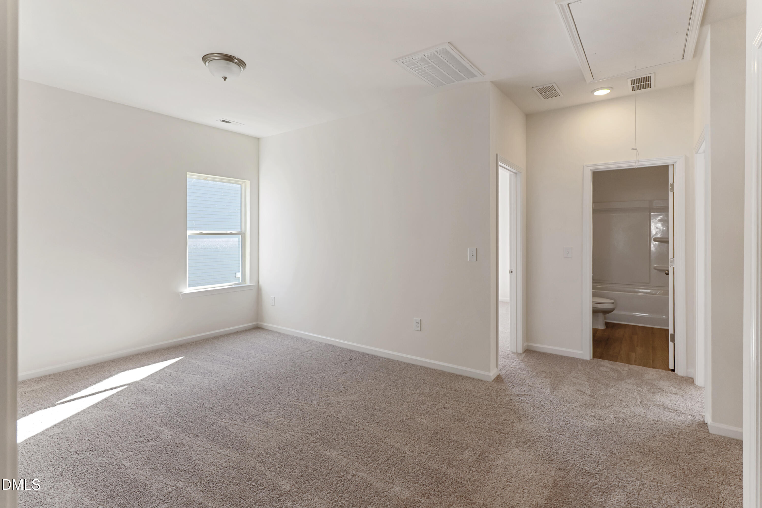 173 Courtside Drive Dunn, NC 28334 - Photo 12 of 24 a view of an empty room with a window