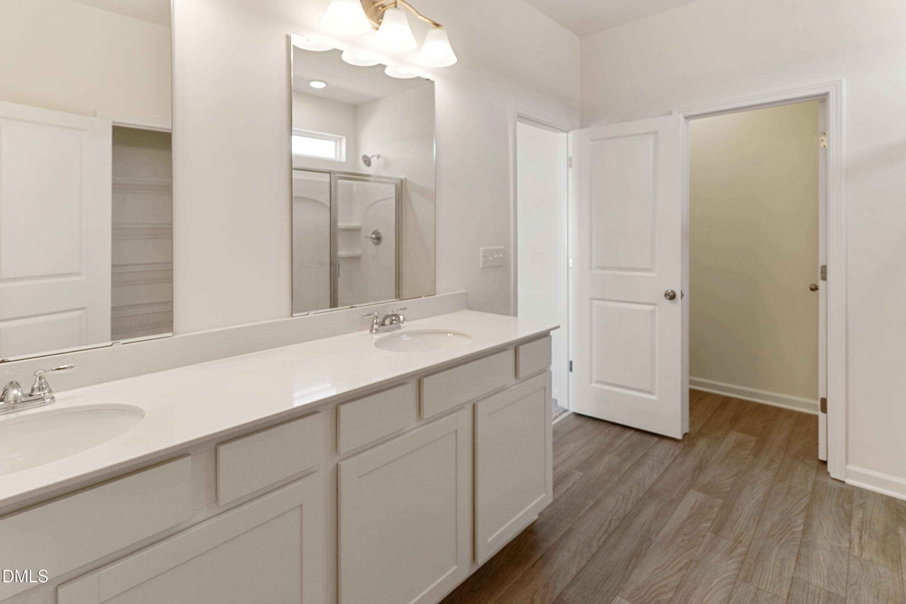 173 Courtside Drive Dunn, NC 28334 - Photo 13 of 24 a bathroom with a double vanity sink mirror and shower