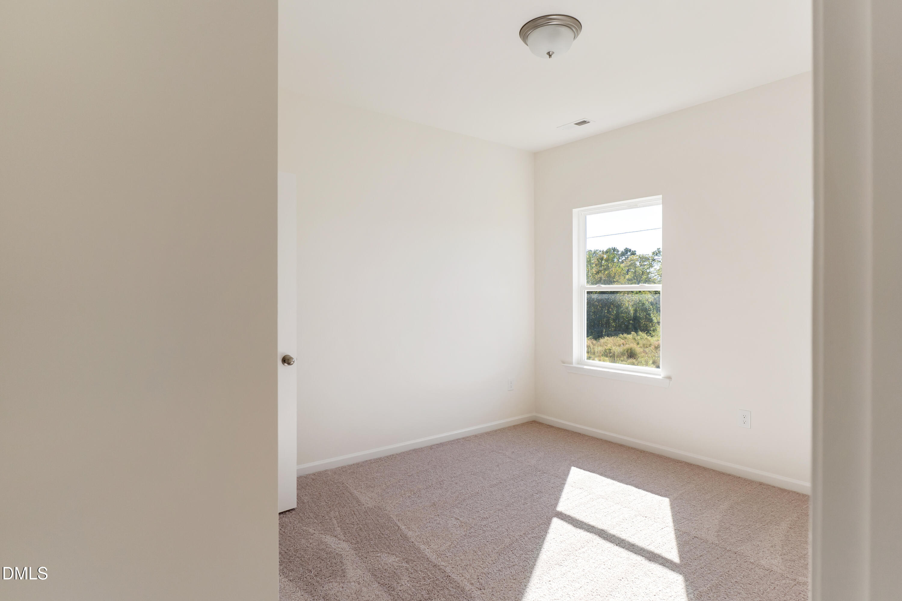 173 Courtside Drive Dunn, NC 28334 - Photo 16 of 24 a view of an empty room with a window
