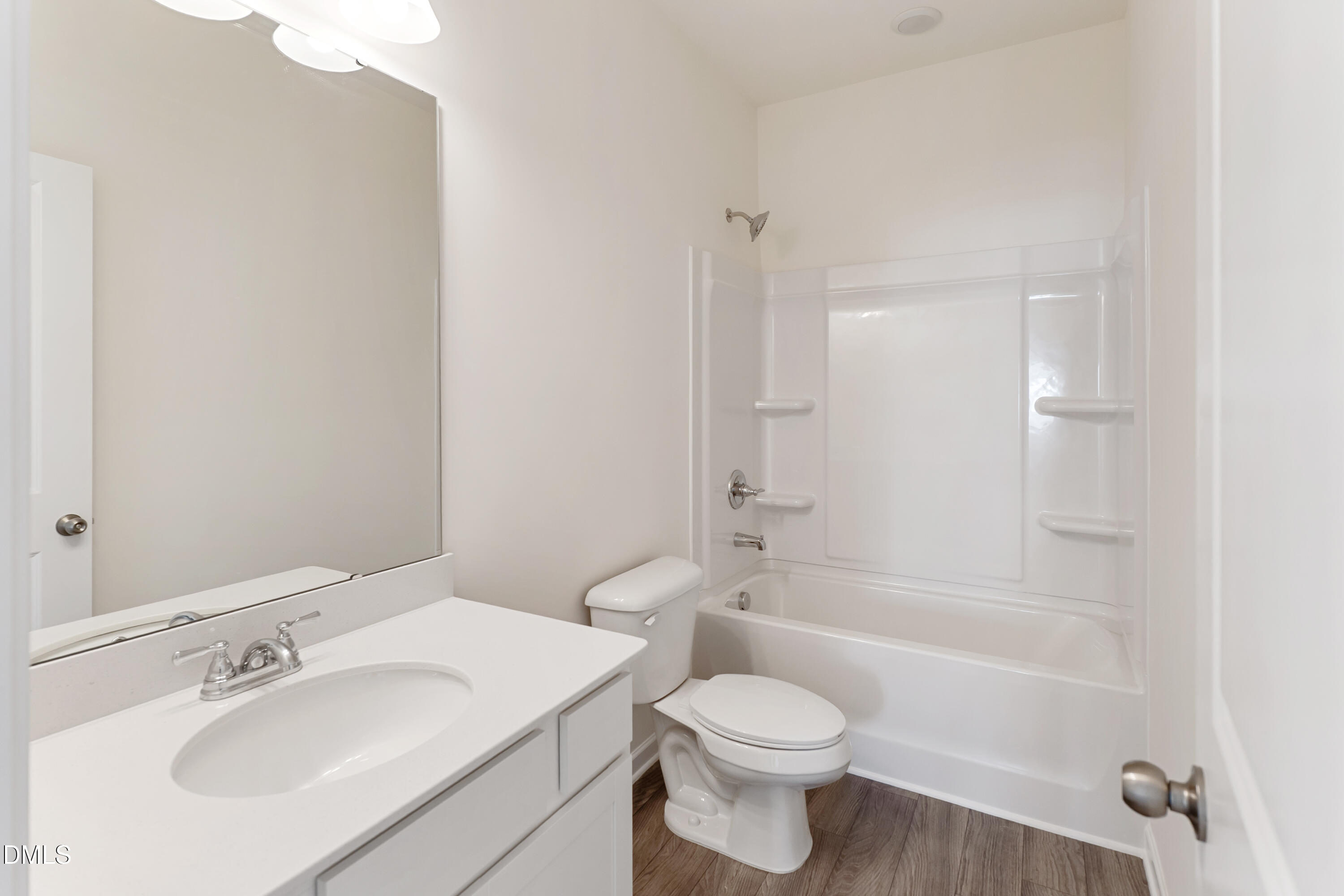 173 Courtside Drive Dunn, NC 28334 - Photo 18 of 24 a bathroom with a toilet a sink and a bathtub