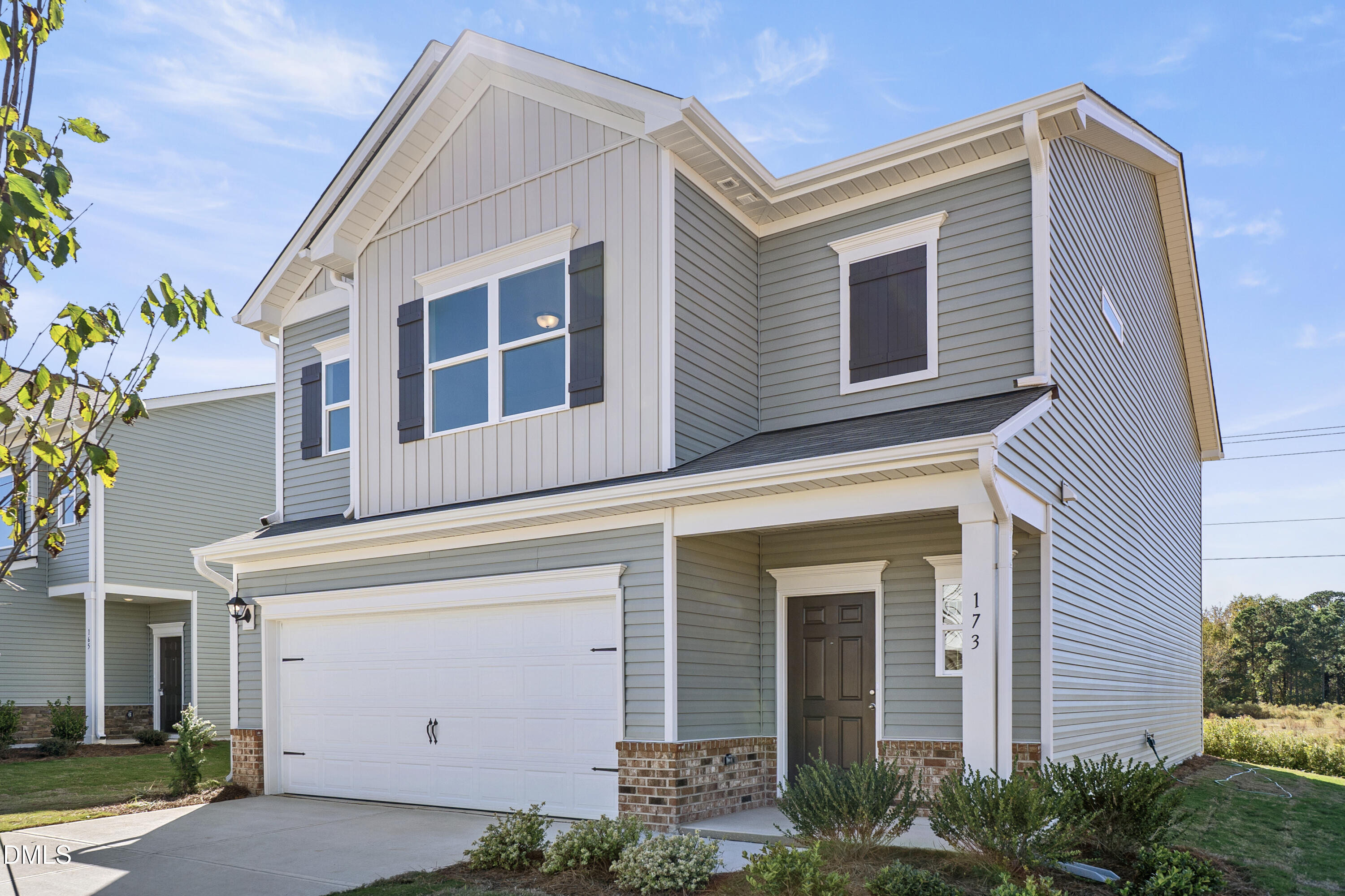 173 Courtside Drive Dunn, NC 28334 - Photo 2 of 24 a front view of a house with a yard