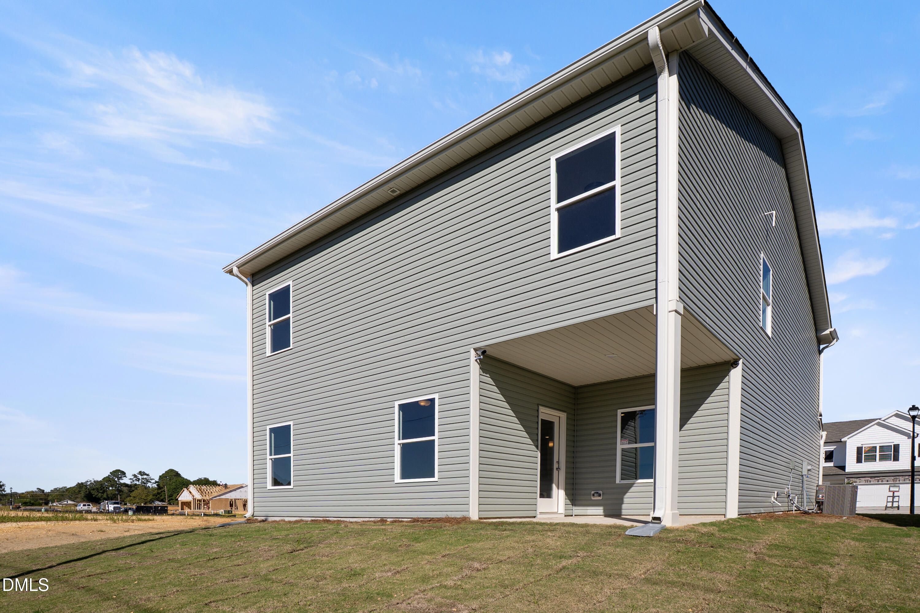 173 Courtside Drive Dunn, NC 28334 - Photo 20 of 24 a view of a house with backyard and lake view