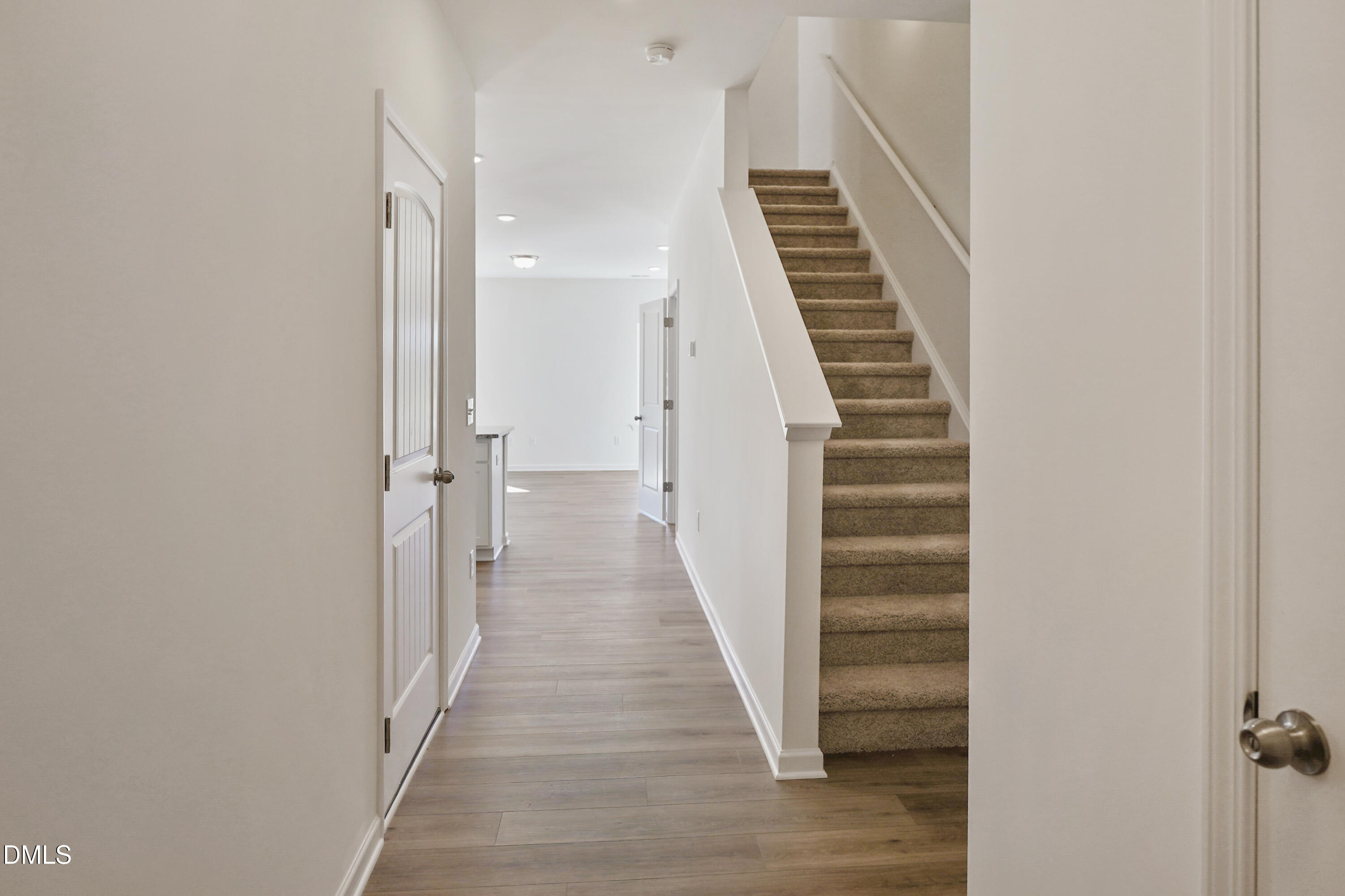173 Courtside Drive Dunn, NC 28334 - Photo 3 of 24 a view of a hallway with wooden floor and entryway