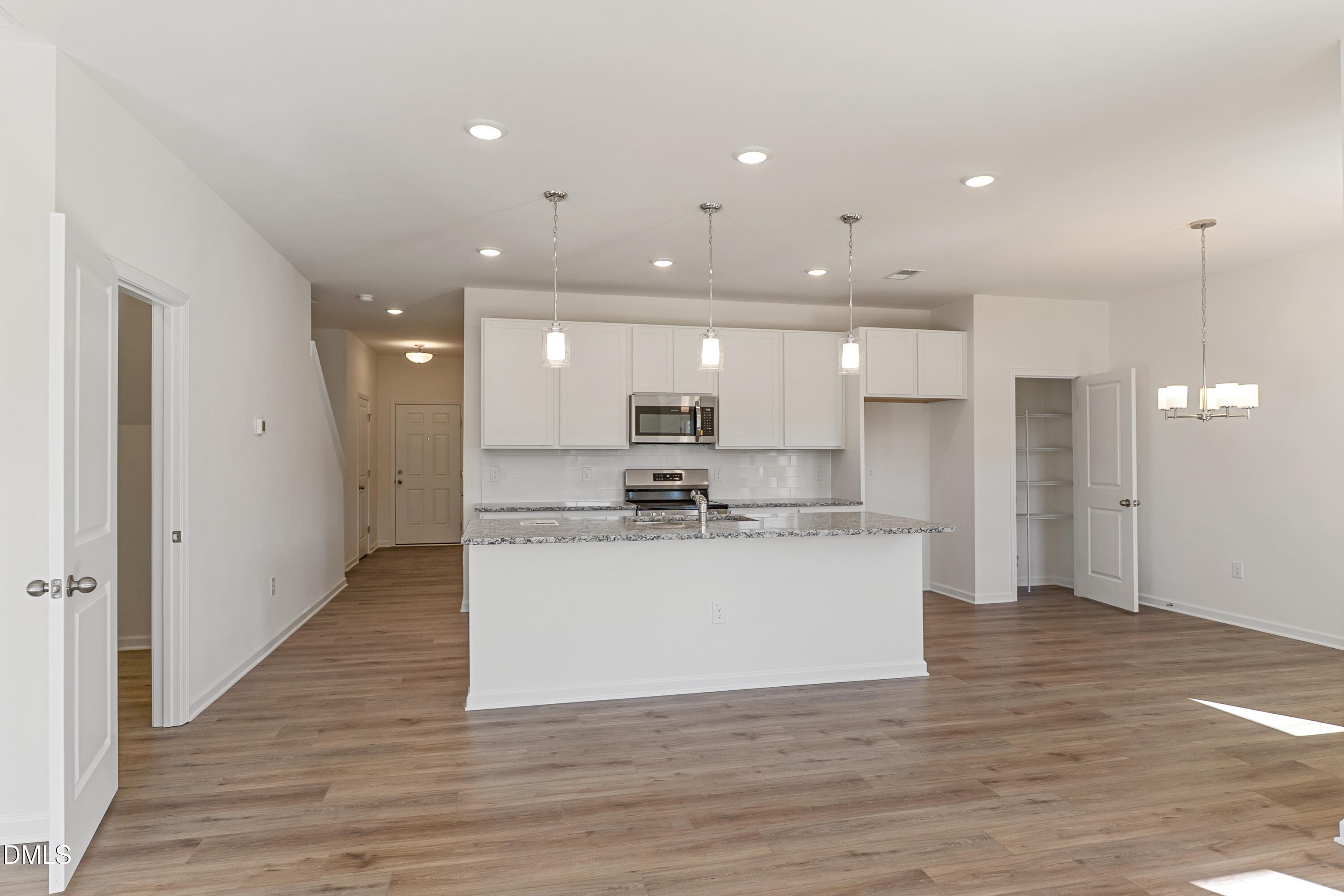 173 Courtside Drive Dunn, NC 28334 - Photo 24 of 24 a view of kitchen with kitchen island stainless steel appliances refrigerator stove microwave and cabinets