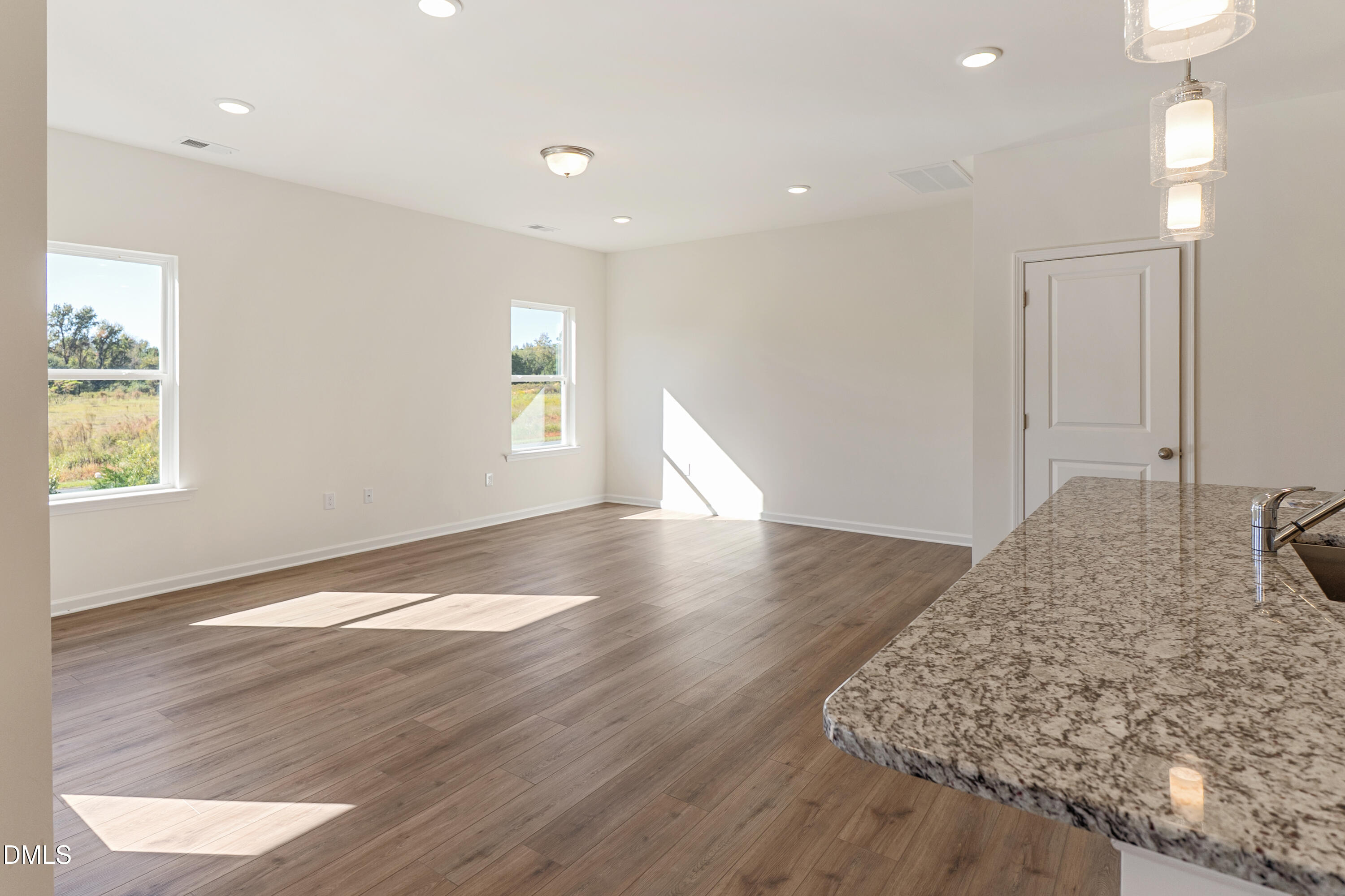 173 Courtside Drive Dunn, NC 28334 - Photo 6 of 24 a view of a kitchen with a sink and wooden floor