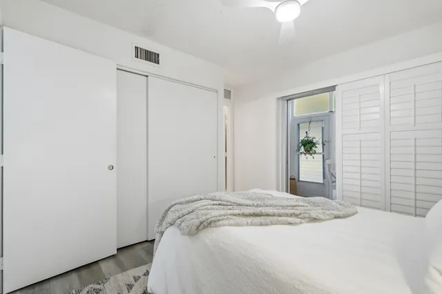 a bedroom with a bed and a bathroom