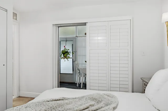 a bathroom with a toilet sink vanity and mirror