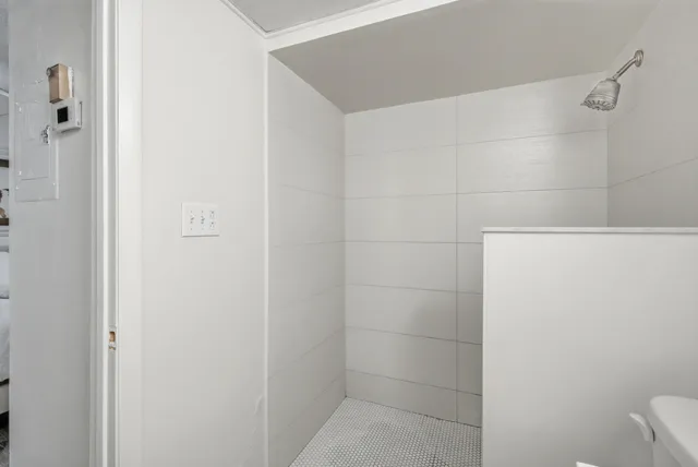 a white table with chairs and a potted plant