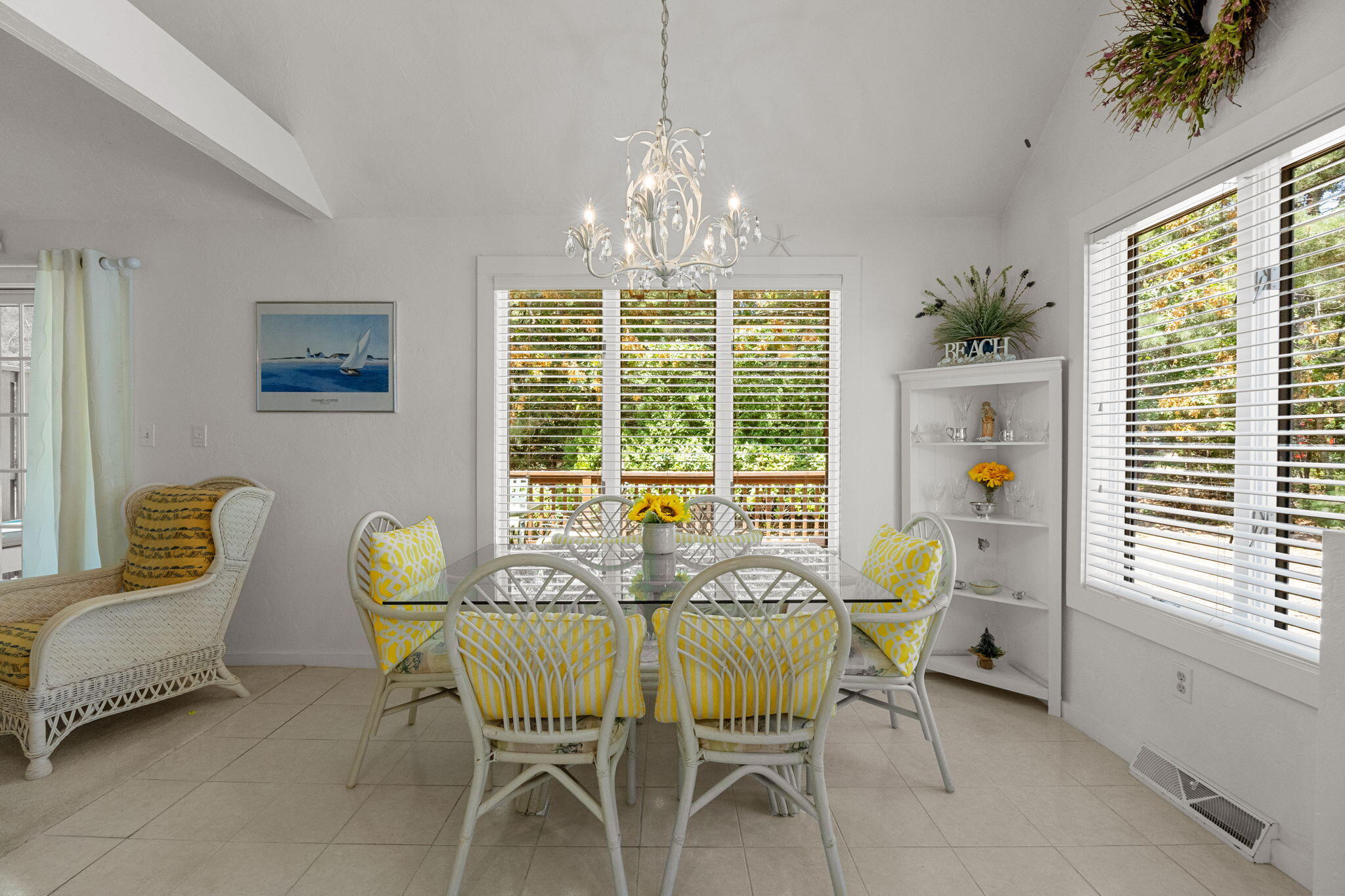 49 Shellback Way, Unit G Mashpee, MA 02649 - Photo 13 of 48 a view of a dining room with furniture a chandelier and large windows