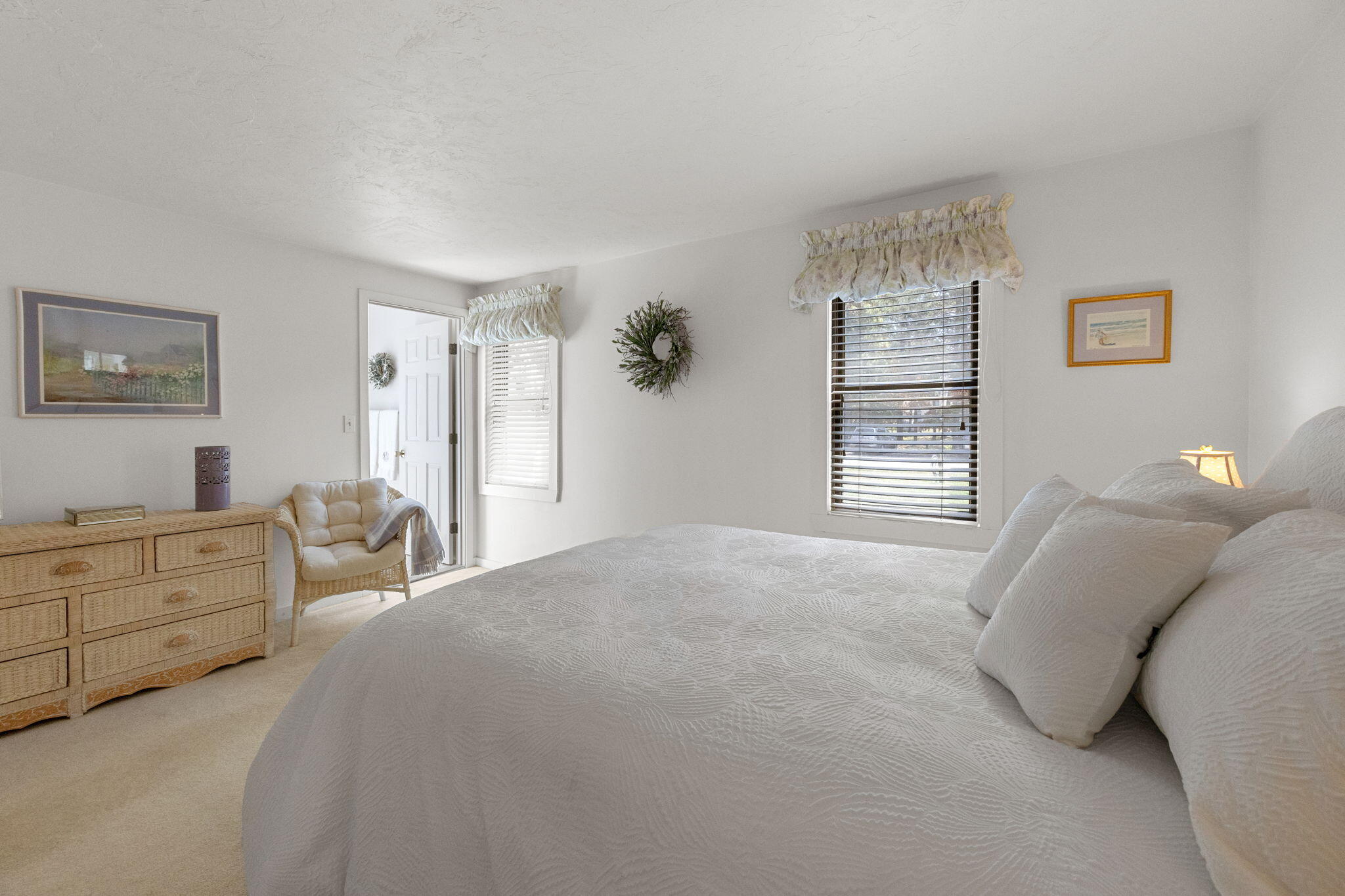 49 Shellback Way, Unit G Mashpee, MA 02649 - Photo 16 of 48 a bedroom with a bed and a couch