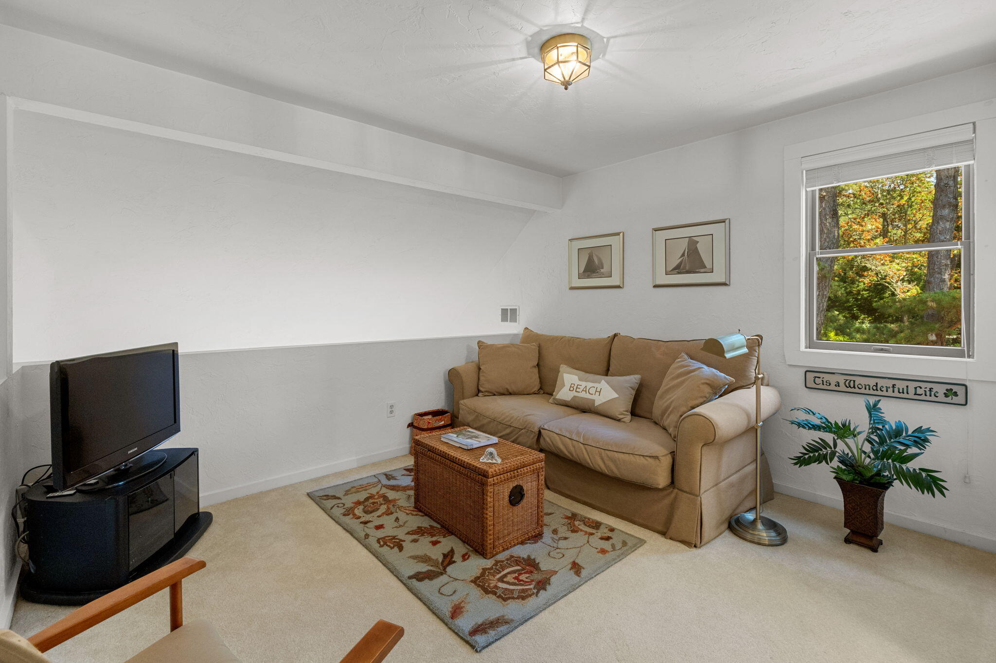 49 Shellback Way, Unit G Mashpee, MA 02649 - Photo 24 of 48 a living room with furniture and a flat screen tv