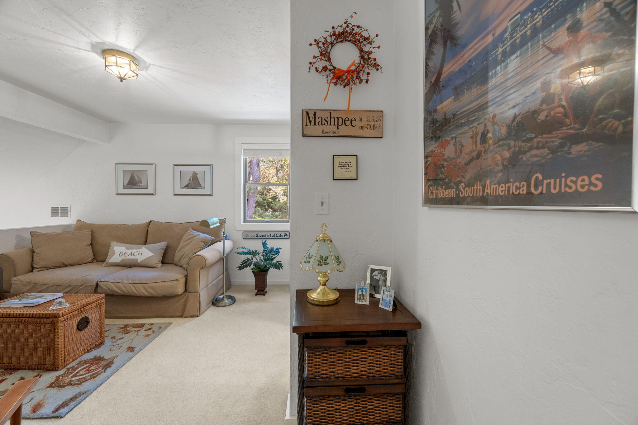 49 Shellback Way, Unit G Mashpee, MA 02649 - Photo 25 of 48 a living room with furniture and paintings on the wall