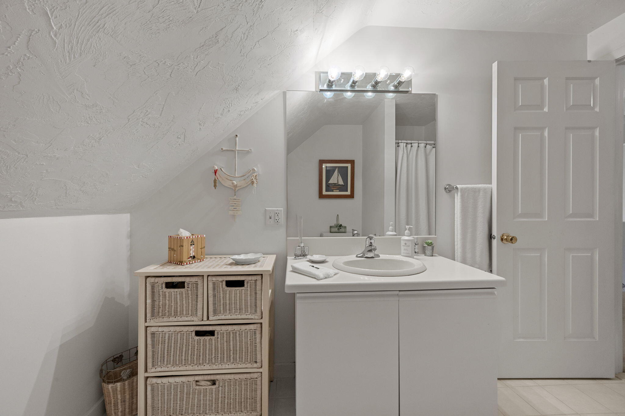 49 Shellback Way, Unit G Mashpee, MA 02649 - Photo 27 of 48 a bathroom with a sink a vanity and mirror