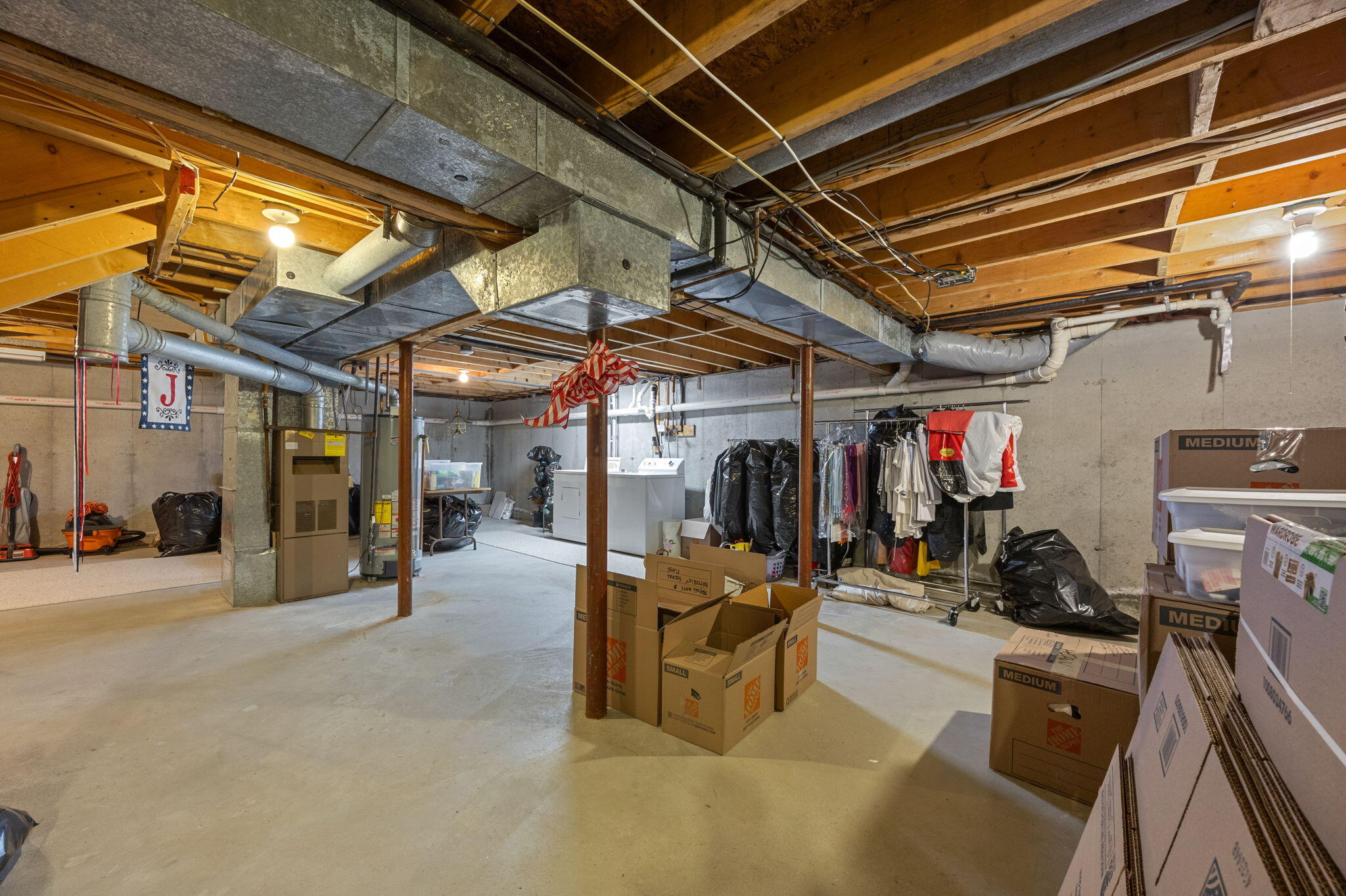 49 Shellback Way, Unit G Mashpee, MA 02649 - Photo 31 of 48 a view of a storage room with a lot of stuff