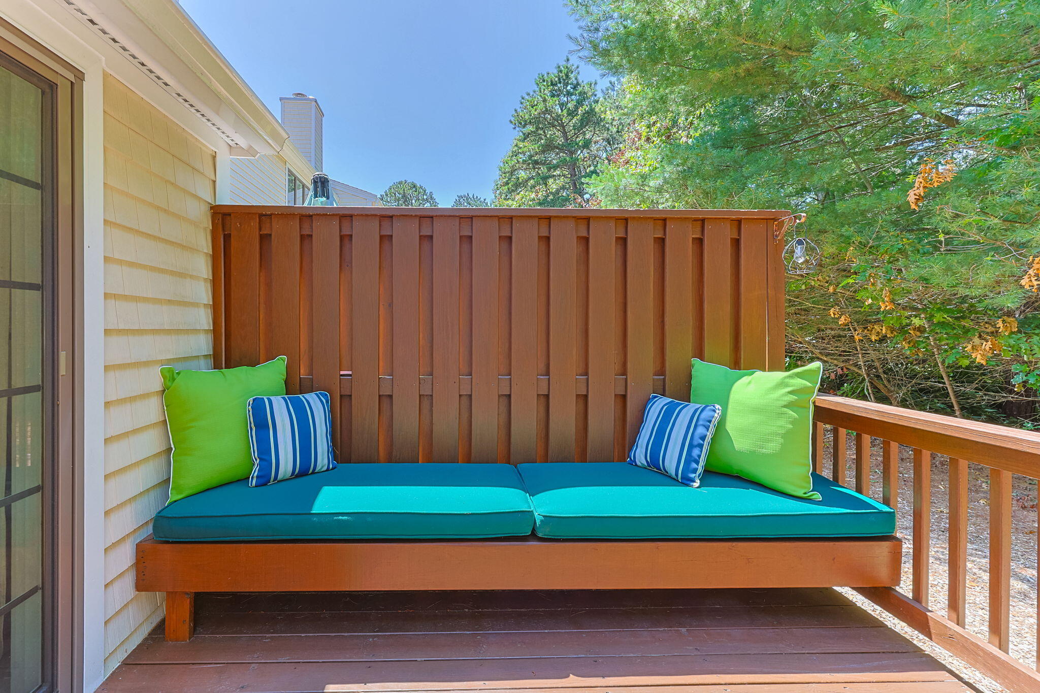 49 Shellback Way, Unit G Mashpee, MA 02649 - Photo 33 of 48 a green bench sitting in front of a house
