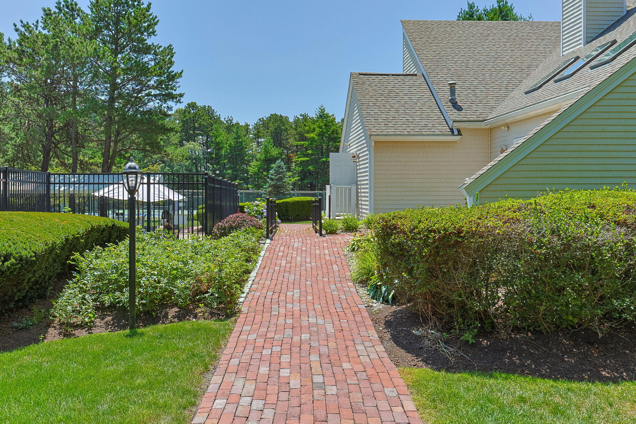 49 Shellback Way, Unit G Mashpee, MA 02649 - Photo 35 of 48 a front view of a house with a yard