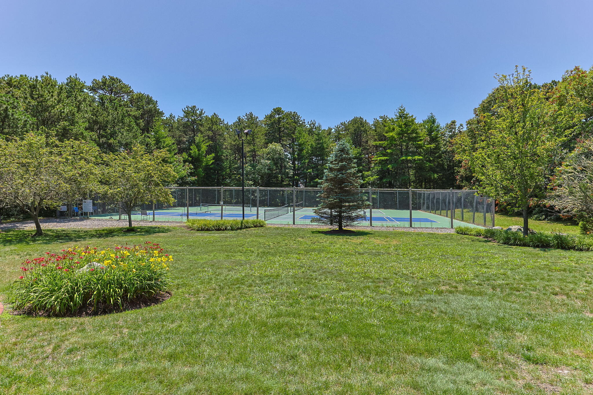 49 Shellback Way, Unit G Mashpee, MA 02649 - Photo 36 of 48 a view of a garden