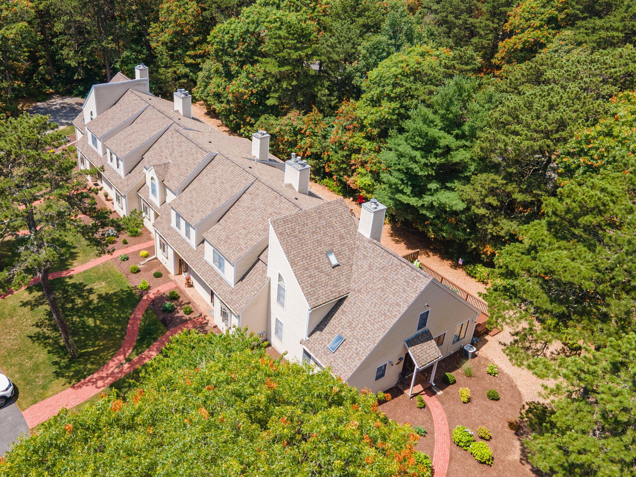 49 Shellback Way, Unit G Mashpee, MA 02649 - Photo 42 of 48 an aerial view of a house with yard and outdoor seating