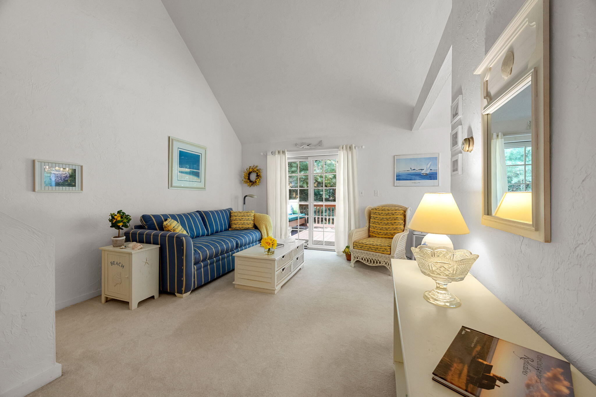 49 Shellback Way, Unit G Mashpee, MA 02649 - Photo 7 of 48 a living room with furniture a chandelier and a window